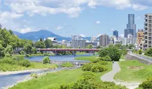 Hozu River with the city on the right and hills in the background