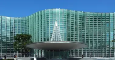A wave of glass forming the exterior of the National Art Centre 