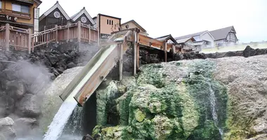 Water pouring into a outdoor cooling pool in Kasatsu Onsen
