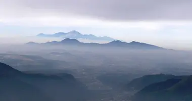 The summits of the Aso caldera, seen from Kusasenri.