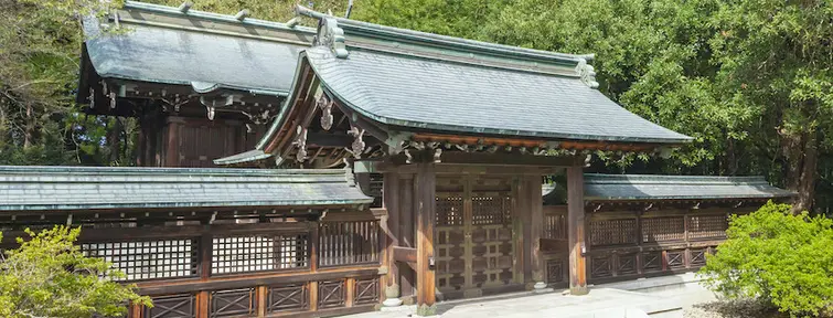 Wooden Shrine surrounded by trees. 